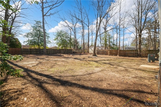 view of yard featuring cooling unit and a fenced backyard