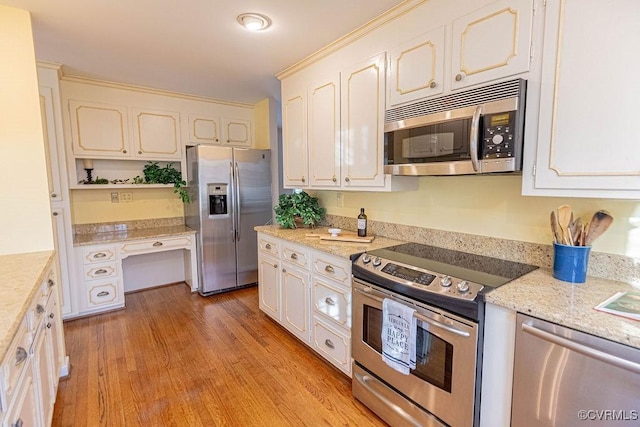 kitchen featuring open shelves, light wood-style flooring, white cabinets, and appliances with stainless steel finishes