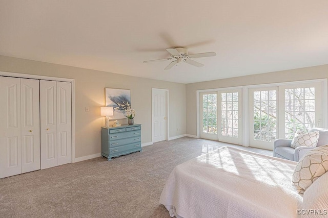 bedroom with light colored carpet, baseboards, and ceiling fan