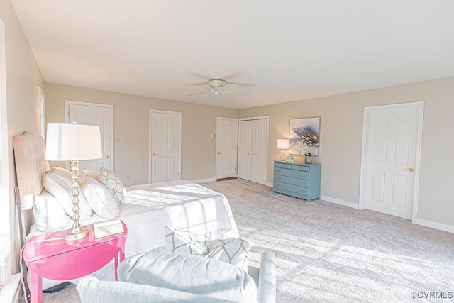 bedroom with baseboards, light carpet, and ceiling fan