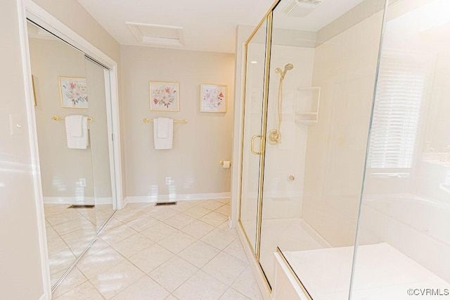 bathroom featuring visible vents, baseboards, a stall shower, and tile patterned flooring