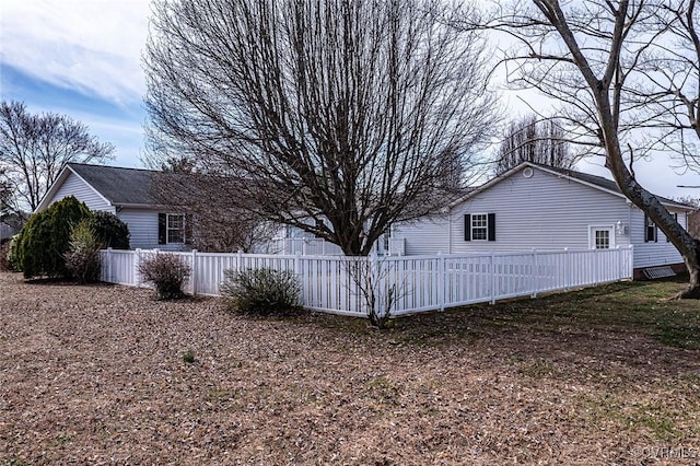 view of property exterior featuring fence private yard