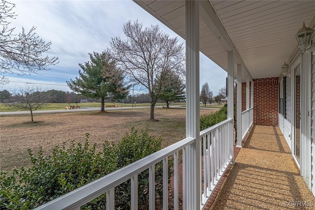 balcony featuring covered porch