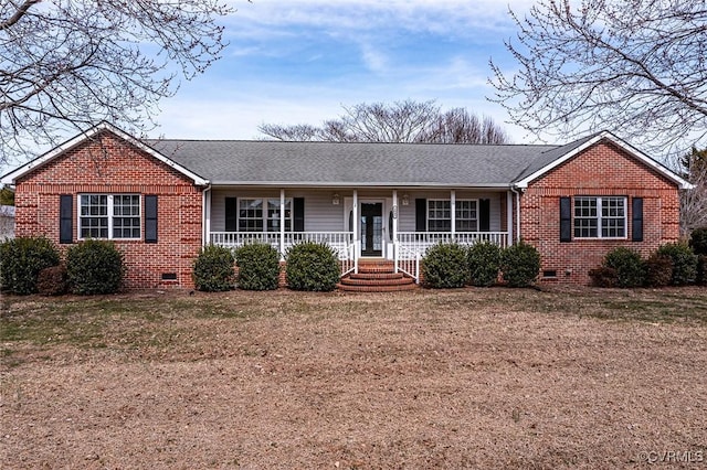 ranch-style house with crawl space, brick siding, covered porch, and roof with shingles