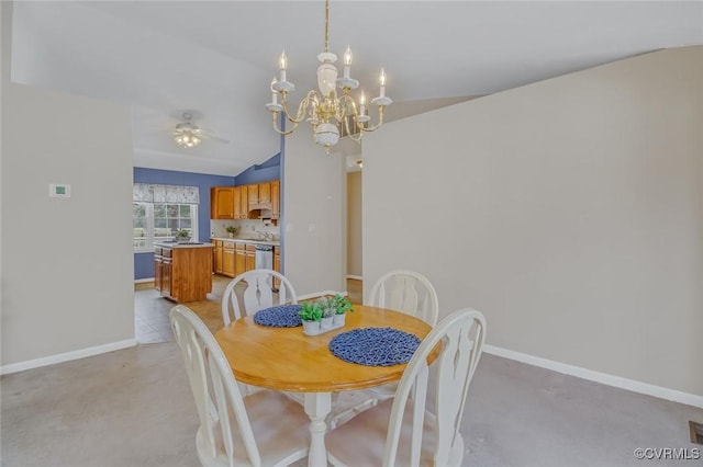 dining area featuring lofted ceiling, ceiling fan with notable chandelier, and baseboards