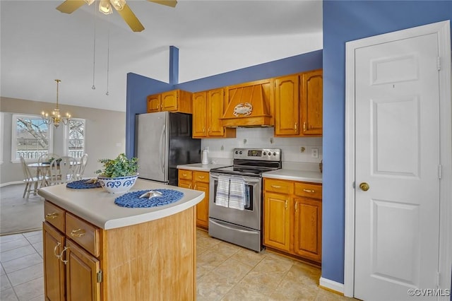 kitchen featuring light countertops, lofted ceiling, brown cabinets, custom exhaust hood, and stainless steel appliances