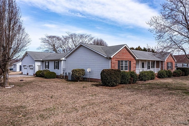 view of front of property featuring an attached garage and brick siding