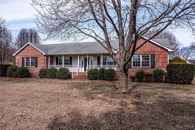 ranch-style home with brick siding and covered porch