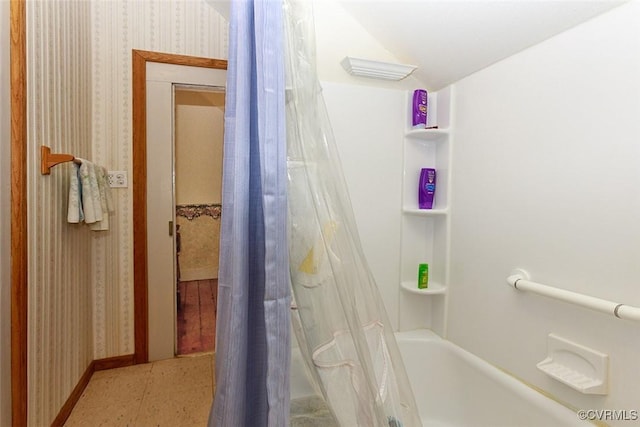 full bathroom featuring wallpapered walls, baseboards, and shower / tub combo with curtain