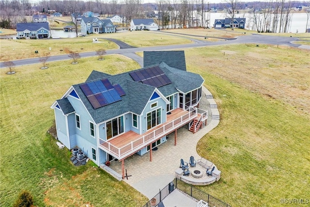 bird's eye view featuring a water view and a residential view