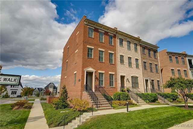 view of building exterior featuring stairs