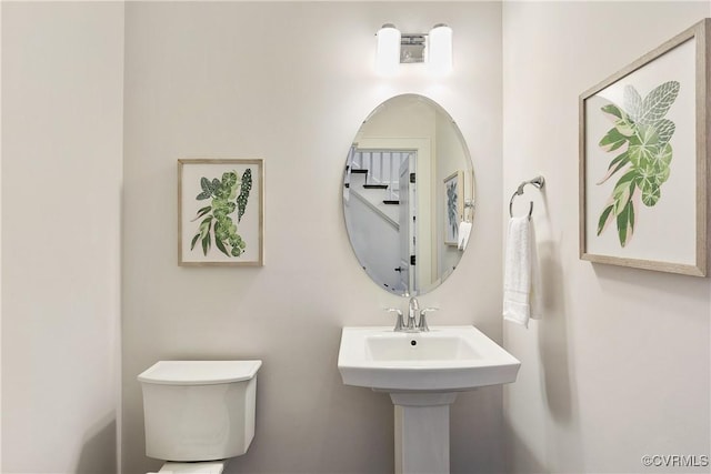 bathroom with toilet and a sink