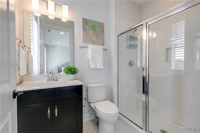 full bathroom with a stall shower, vanity, and toilet