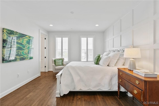 bedroom with dark wood-style floors, baseboards, and recessed lighting