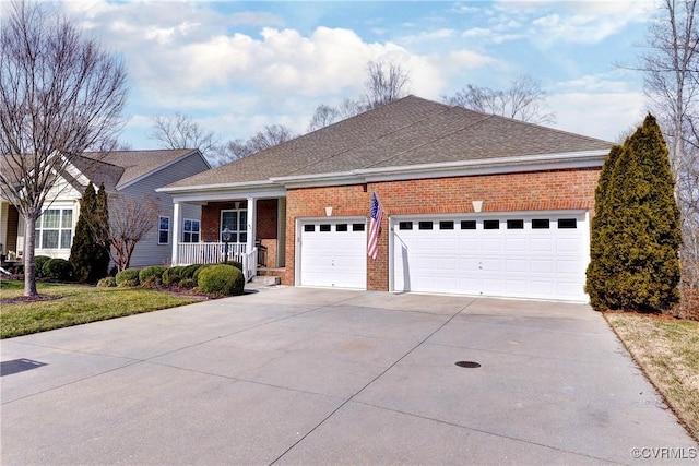 ranch-style home featuring driveway, covered porch, and brick siding