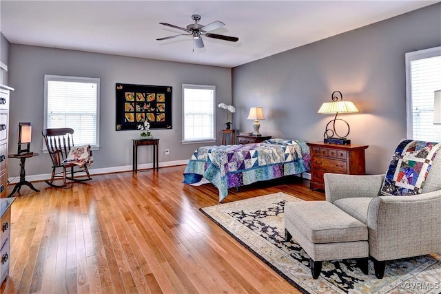 bedroom featuring hardwood / wood-style floors and baseboards