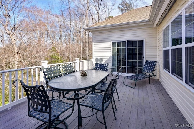 wooden terrace with outdoor dining space