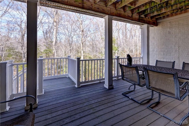 deck featuring outdoor dining area