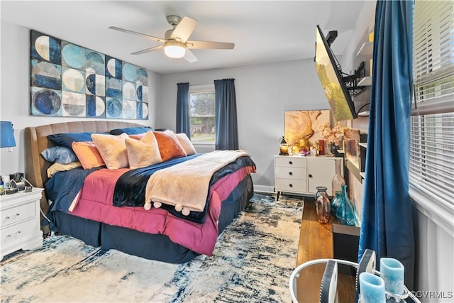 bedroom featuring ceiling fan and wood finished floors