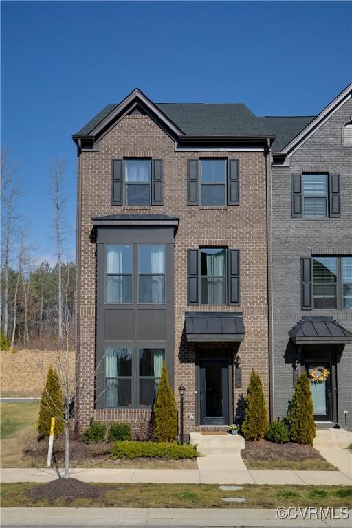 view of property with brick siding