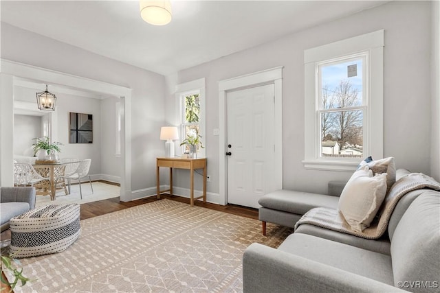 living room featuring baseboards and wood finished floors