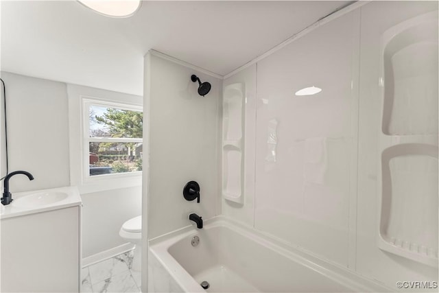 bathroom featuring marble finish floor, shower / tub combination, vanity, and toilet