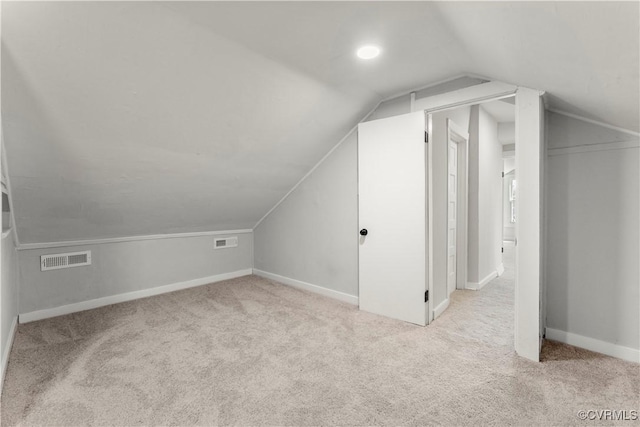 bonus room with lofted ceiling, carpet, visible vents, and baseboards