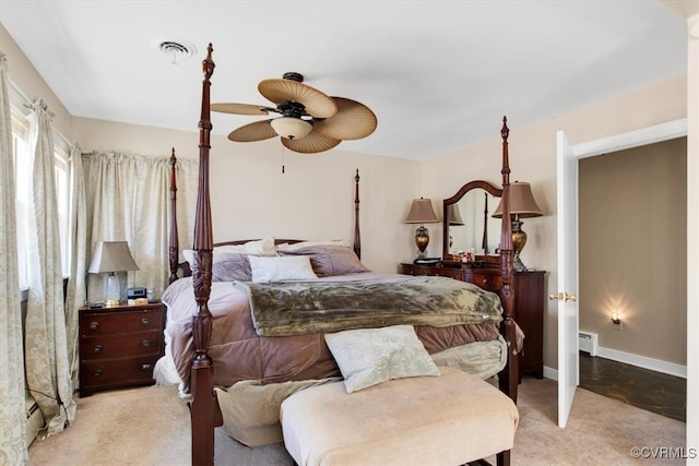 bedroom featuring carpet, visible vents, baseboards, and a ceiling fan