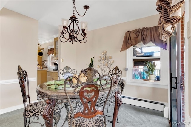 carpeted dining room featuring baseboards, a baseboard radiator, and an inviting chandelier