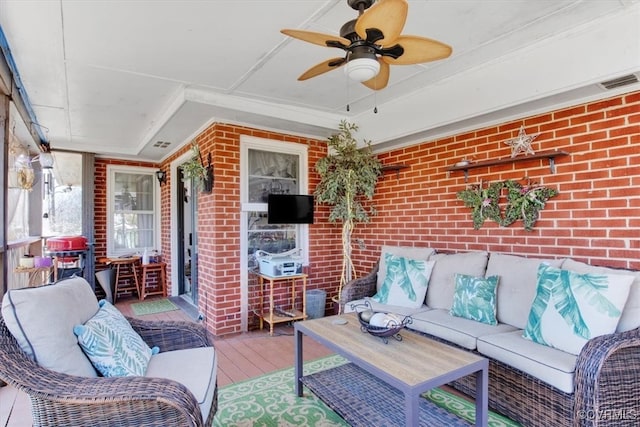 view of patio / terrace with ceiling fan, visible vents, an outdoor living space, and a wooden deck