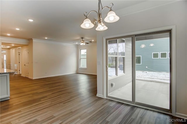 interior space featuring recessed lighting, ceiling fan with notable chandelier, wood finished floors, baseboards, and ornamental molding