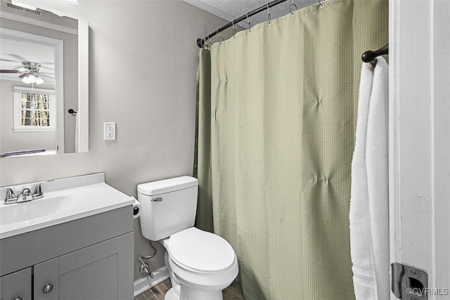 full bath featuring visible vents, baseboards, toilet, vanity, and a ceiling fan