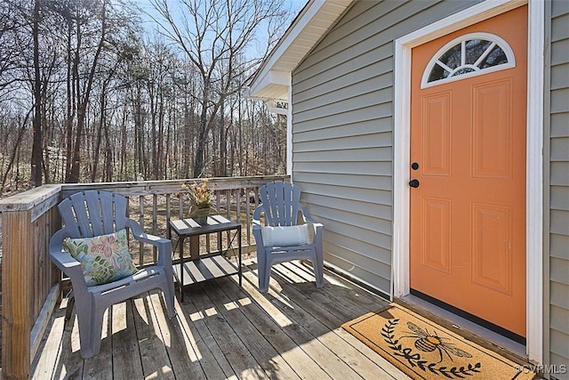 entrance to property featuring a wooden deck