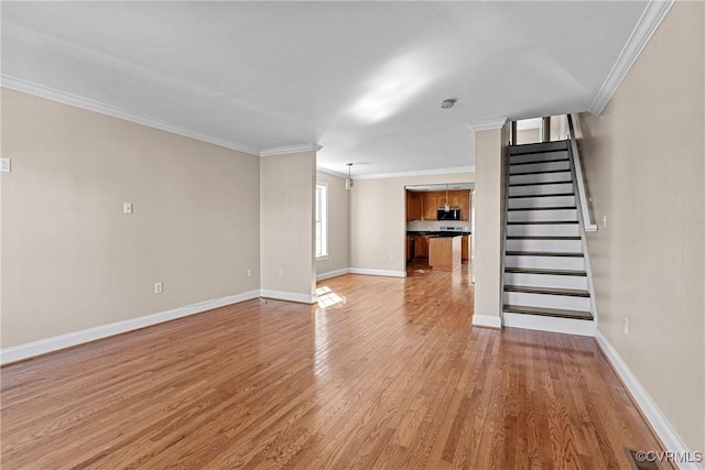 unfurnished living room with stairs, crown molding, baseboards, and light wood-style floors