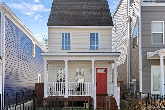 view of front of home with fence, a porch, and roof with shingles