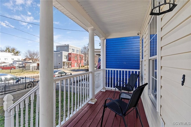 balcony with a residential view and covered porch