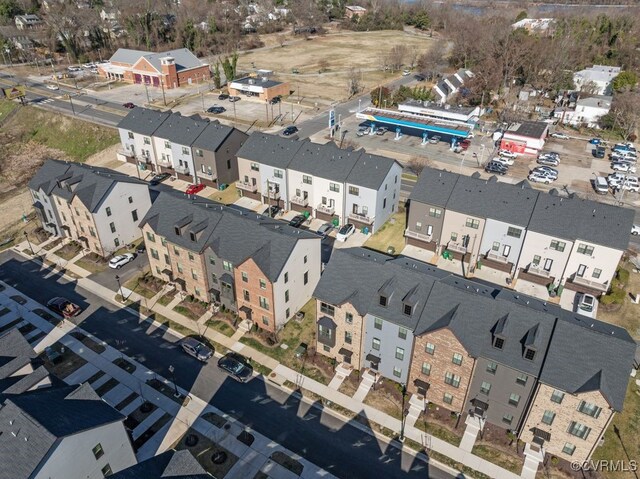 birds eye view of property with a residential view