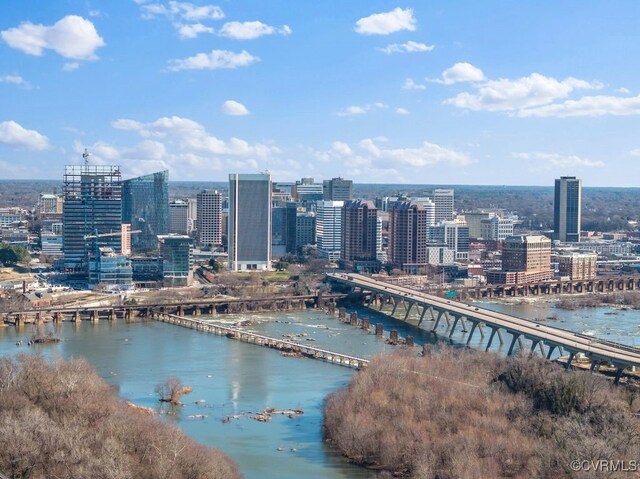 aerial view featuring a view of city and a water view