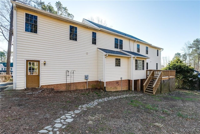 back of house with a deck and stairway