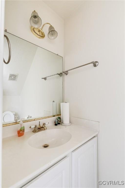 bathroom with visible vents and vanity