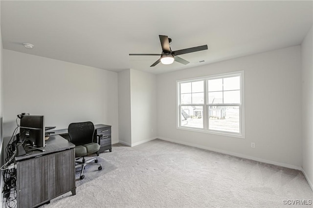 office area with baseboards, carpet, and ceiling fan
