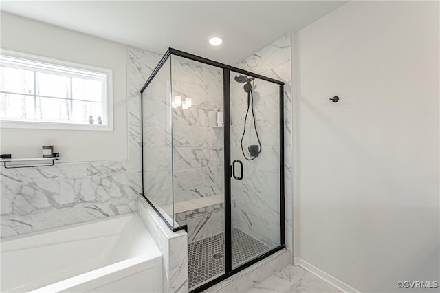 full bathroom with a garden tub, marble finish floor, baseboards, and a marble finish shower