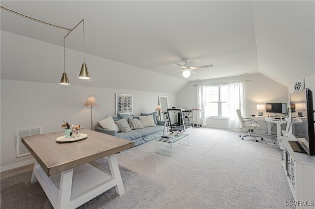living area featuring carpet floors, a ceiling fan, lofted ceiling, and visible vents