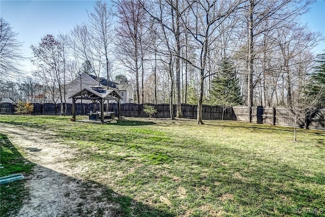 view of yard with a gazebo and a fenced backyard