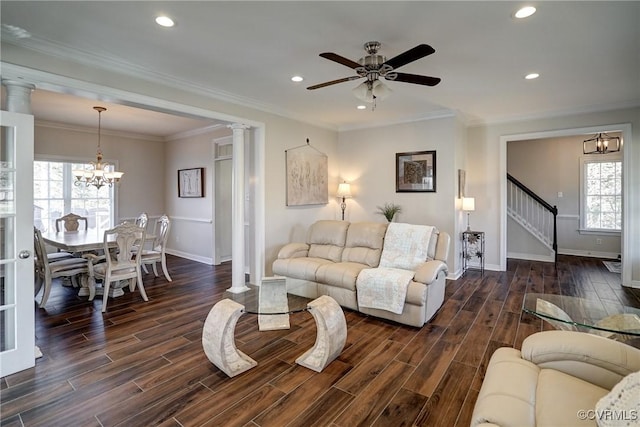 living area with wood finish floors, baseboards, ornate columns, and ornamental molding