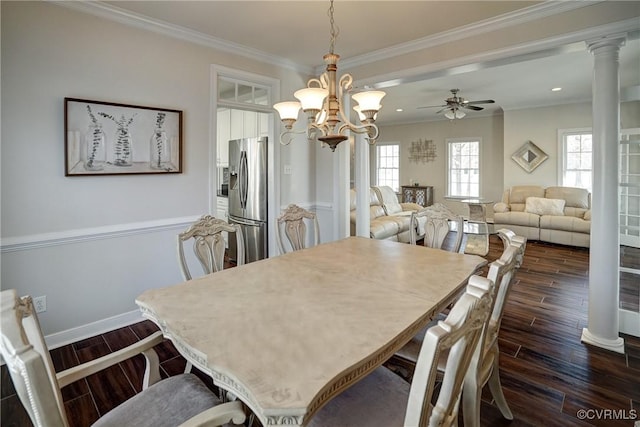 dining room with dark wood-style flooring, baseboards, ornate columns, and ornamental molding