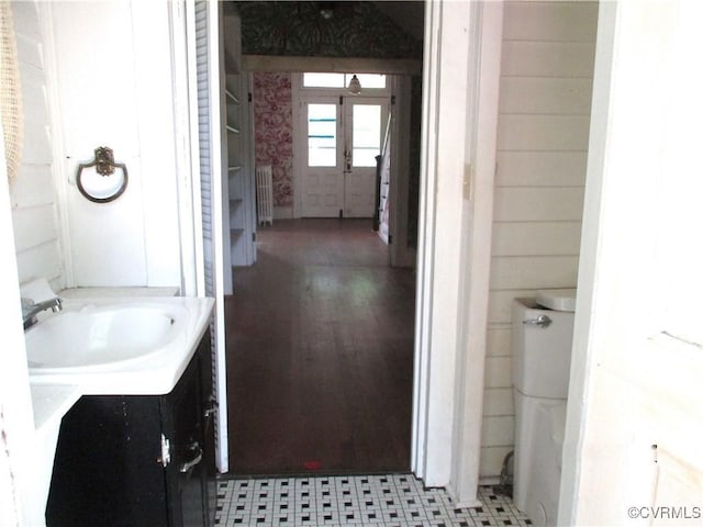 bathroom featuring radiator and vanity