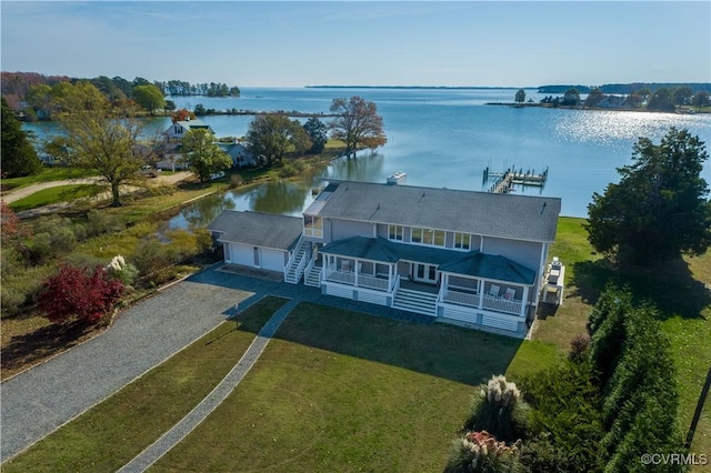 drone / aerial view with a water view