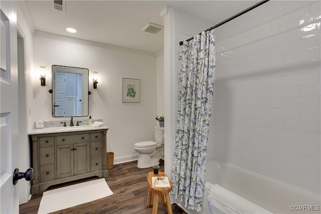 full bathroom with shower / tub combo, toilet, wood finished floors, crown molding, and vanity