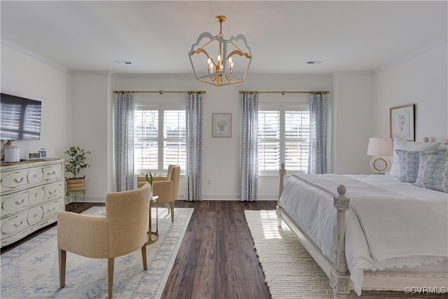 bedroom featuring multiple windows, ornamental molding, and wood finished floors